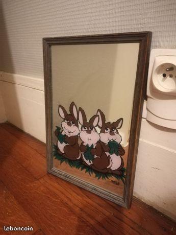 Miroir avec trois lapins