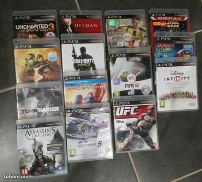 PS3 ultra slim 500 giga + 2manettes + 14 jeux